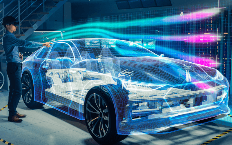 1 Mann steht vor einem virtuell dargestellten Auto und schaut sich die darübergleitenden Windströmungslinien durch eine VR-Brille an 1 Mann steht vor einem virtuell dargestellten Auto und schaut sich die darübergleitenden Windströmungslinien durch eine VR-Brille an